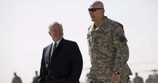 Gates hints at faster Iraqi pullout if leaders curb feuds
